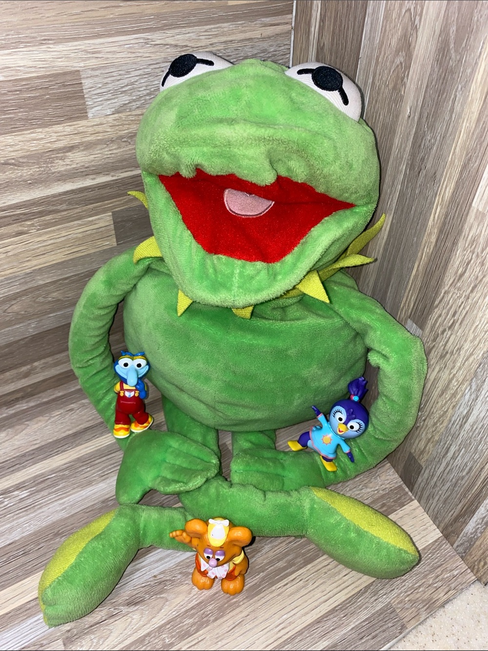 Jim Henson muppet’s Kermit the frog hand puppet and mini figures